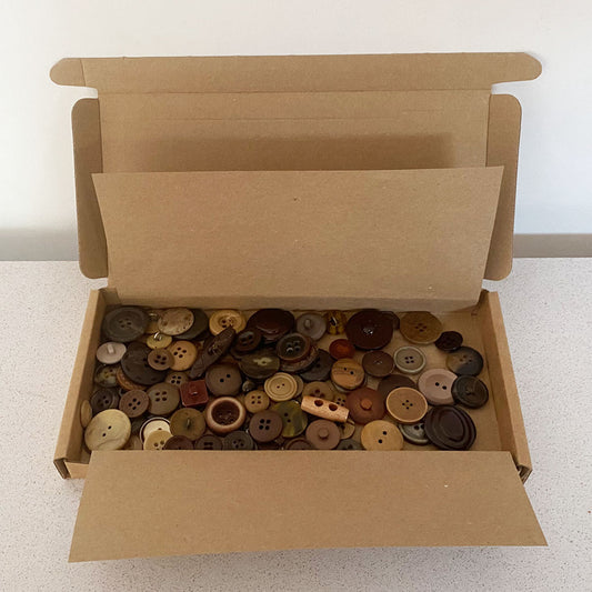 Browns vintage and new buttons sorted by colour and sold by weight