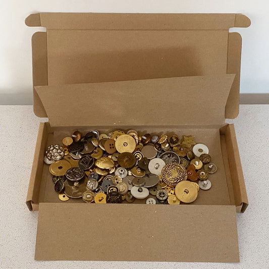 Metals vintage and new buttons sorted by colour and sold by weight