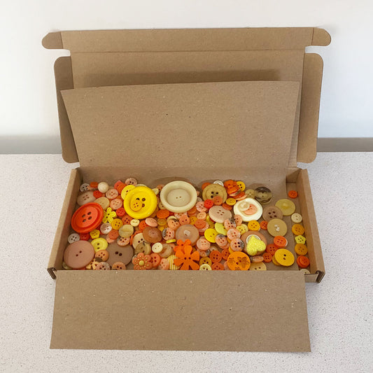 Orange and Yellows vintage and new buttons sorted by colour and sold by weight