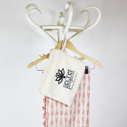 Secret Scarf, Ikkat cream & peach pom-poms